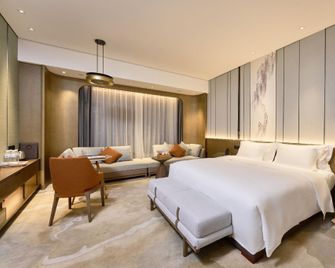 Phoenix International Hotel - Dazhou - Bedroom