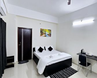 Alpine Inn - Guwahati - Bedroom