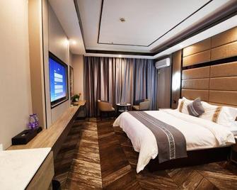 Style Hotel - Nyingtri - Slaapkamer