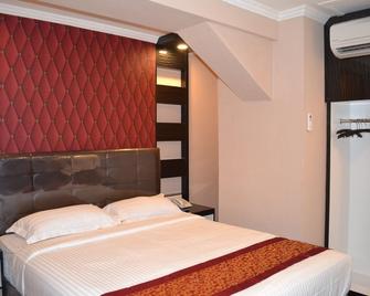 Puncak Budget Hotel - Pangkalpinang - Bedroom