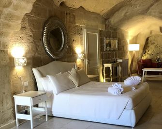 كافيوسو هوتل - ماترا - غرفة نوم