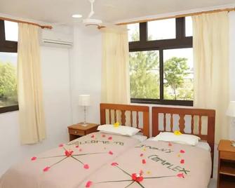 Global Village Apartment - Roche Caiman - Chambre