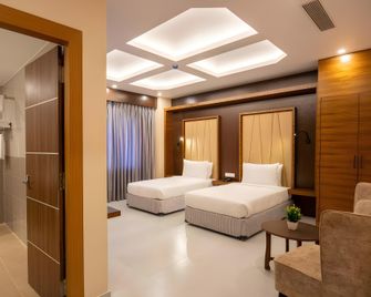 Hotel Palm International By Pipal - Butwāl - Bedroom