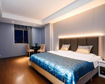 Dijia Hengyun Manju Hotel (Hengyang Jiefang Road Branch) - Hengyang - Schlafzimmer