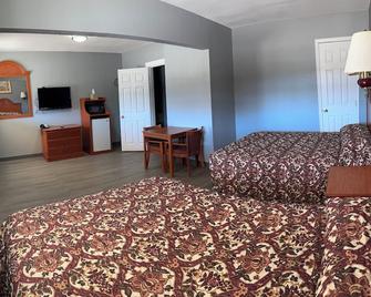Budget Inn Magnolia - Magnolia - Спальня
