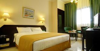 Hotel Al Madinah Holiday - Mascate - Camera da letto