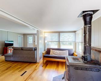 Dog-friendly cottage with a wood stove, washer/dryer, firepit, & large yard - North Creek - Living room