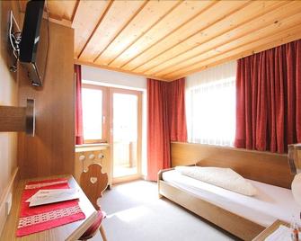 Pension Mittagskogel - St. Leonhard im Pitztal - Bedroom