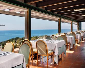 Ecovillage with swimming-pool surrounded by greenery, apartments with air conditioning and outdoor private area - Teulada - Restaurant