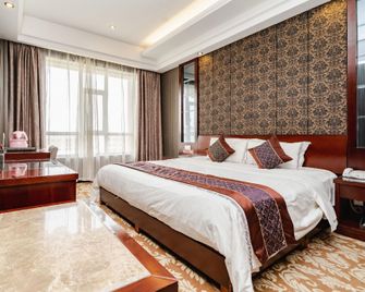 Han Tang · Grand Hotel - Jiuquan - Slaapkamer