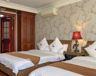 Daily Mega Holiday Hotel - Dalian - Bedroom