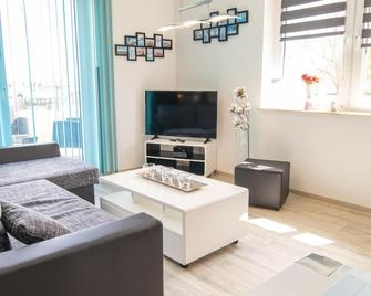 Vacation apartment Fischerblick - Holiday apartments at the harbor - Reinberg - Sala de estar