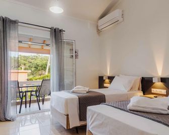 Riposo Studios & Apartments - Kavos - Camera da letto