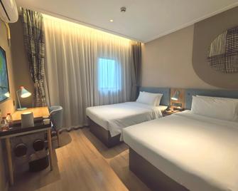 Home Inn Neo Nantong Century Avenue Chongchuan Science Park - Nantong - Bedroom