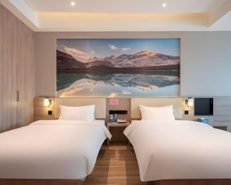 Xingyue Hotel (Xuzhou Suning Plaza Railway Station) - Xuzhou - Camera da letto