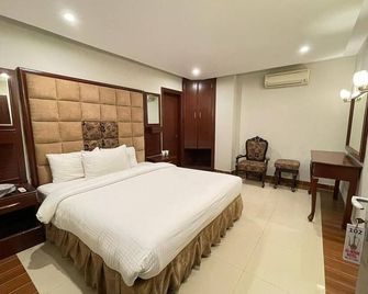 Al-Noor Hotel Multan - Multān - Camera da letto