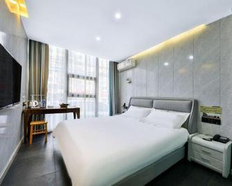 Xinxiangdao Business Hotel (Jinzhou Normal University) - Jinzhou - Bedroom