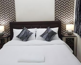 Cess Summer Boutique Hotel - Kalibo - Ložnice