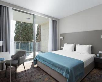 Sport Inn Hotel - Soci - Camera da letto