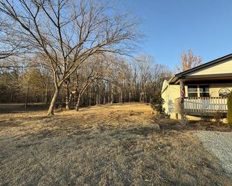 Hillside farmhouse \nLocated on 50 acres \n - Collierville - Outdoors view