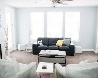 Enjoy the warm Summer Breeze in this modern 3BR, 2BA Downtown Condo - Ludington - Living room