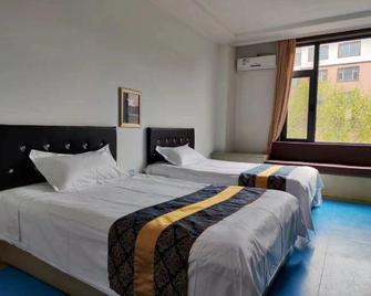 Tianmin Fashion Hotel - Yanbian - Habitación