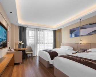 Wellton City Hotel (Ganzhou Railway Station) - Ganzhou - Bedroom