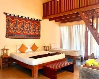 Giman Free Beach Resort - Kalkudah - Schlafzimmer