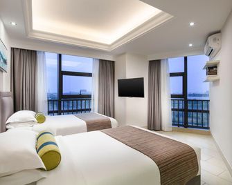 Tianyi International Hotel (Nandujiang Meilan Airport Branch) - Haikou - Habitación