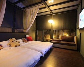 日月潭潭香時尚渡假旅館-水社碼頭 - 魚池鄉 - 臥室