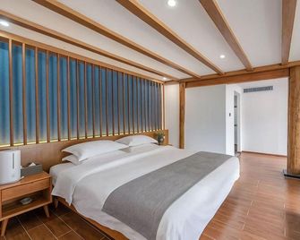 Mulanyu Tangsu Hotel - Lijiang - Schlafzimmer