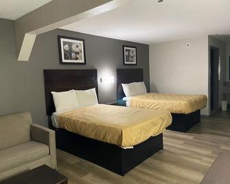 Speedway Inn & Suites - Griffin - Bedroom