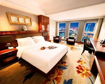 Mingdu Gloria Plaza Hotel Qingdao - צ'ינגדאו - חדר שינה