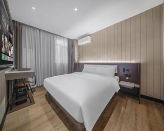 Hanting Hotel Qingdao Licang Jinshui Road - צ'ינגדאו - חדר שינה