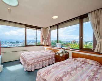 Nigitatsu Kaikan - Matsuyama - Bedroom