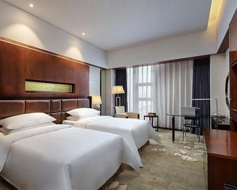 Vienna International Hotel - Tongling - Yatak Odası