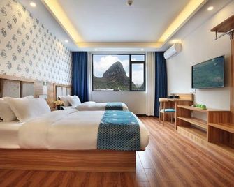 Qingyunge Hotel - Guilin - Camera da letto