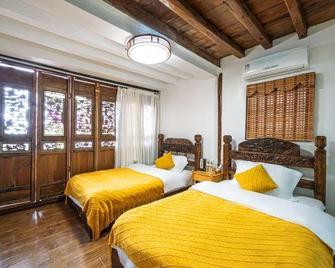 Yuhuai Renjia Inn - Lệ Giang - Phòng ngủ
