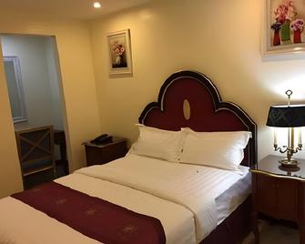 Rainbowland Hotel - Olongapo City - Slaapkamer