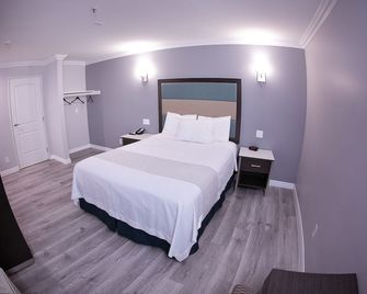 Travelodge Inn & Suites by Wyndham West Covina - West Covina - Ložnice