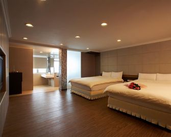 Kylin Peak Hotspring Resort - טאיצ'ונג - חדר שינה