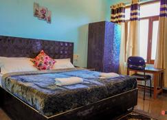 Radha Gopal Royal Resort - Kausani - Bedroom