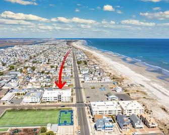 CENTRALLY located in Stone Harbor across the street from the beach and 1 block to downtown shopping, restaurants and entertainment. - Stone Harbor