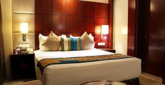 Sky City Hotel - Gurugram - Phòng ngủ