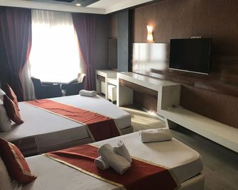Ozcelik Hotel - Salihli - Schlafzimmer