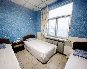 Shenyang Xinhongyuan Guest House - Shenyang - Habitación
