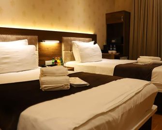 Grand Avenue Hotel - טשקנט - חדר שינה