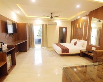 teertham hotel - Харідвар - Спальня