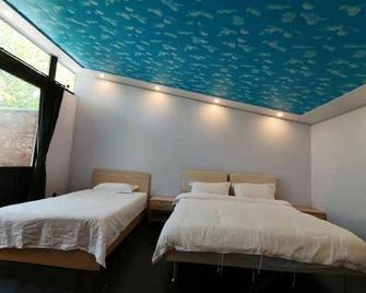 Xinshuangquan Hostel - Beijing - Bedroom