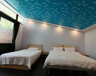 Xinshuangquan Hostel - Beijing - Bedroom